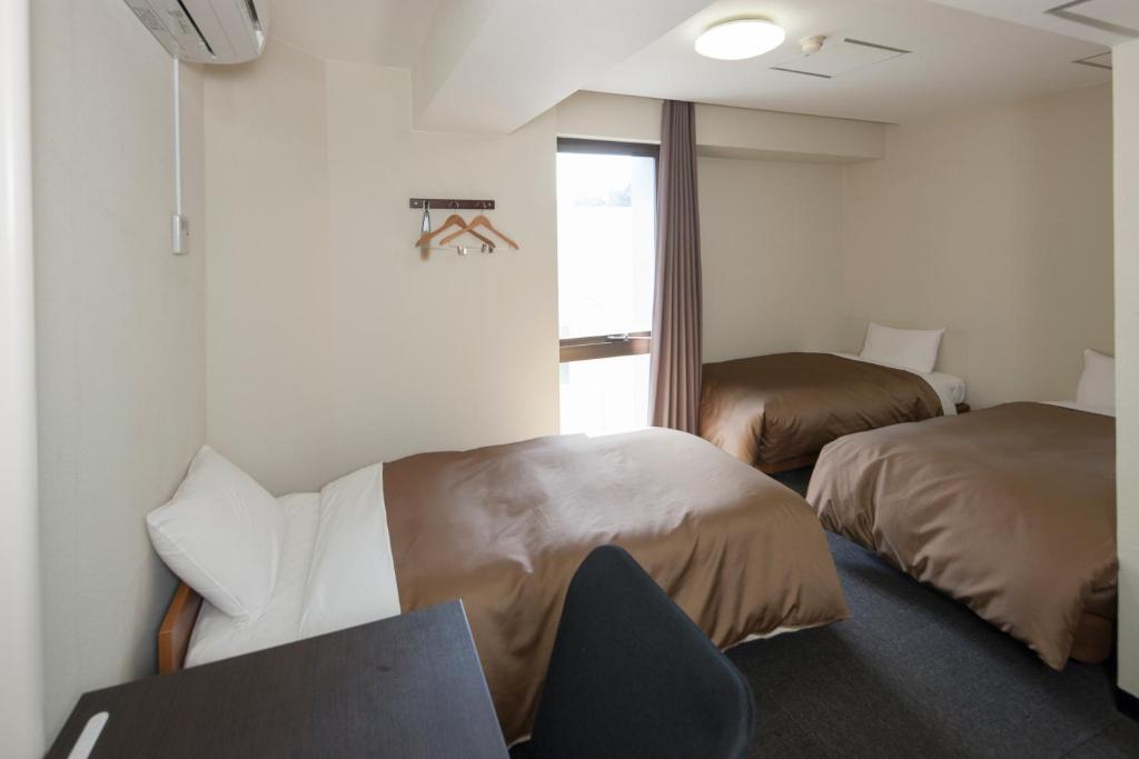 Hotel Plaza Inn Tokusima Szoba fotó
