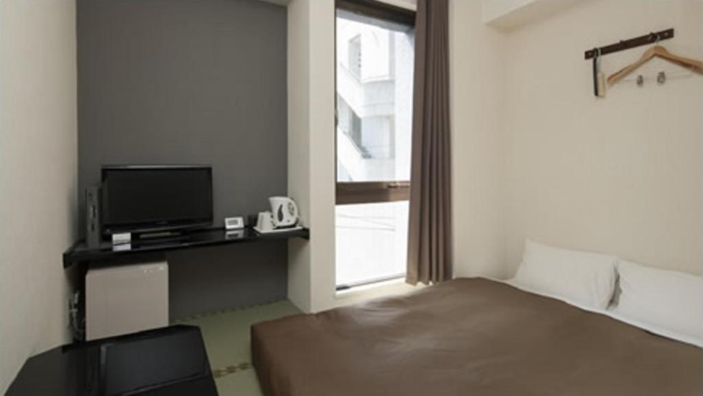 Hotel Plaza Inn Tokusima Szoba fotó